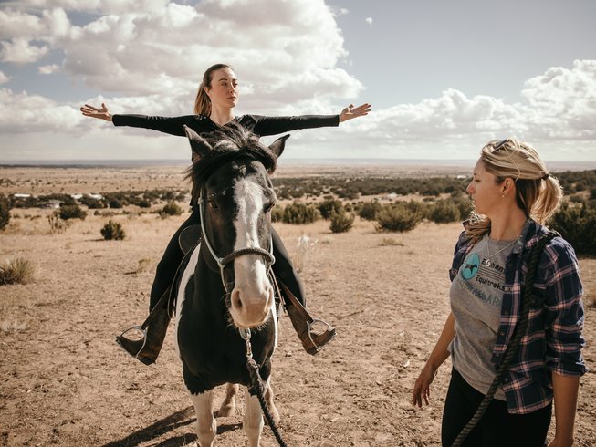 Women horseback riding in one of the top-rated yoga retreats in New Mexico