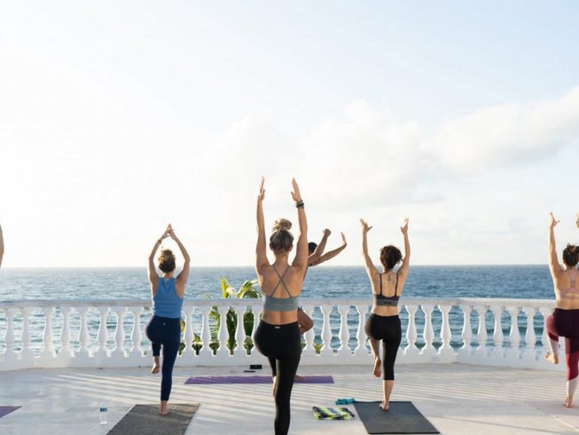 Women practicing yoga in one of the best spots for yoga retreats in Tulum