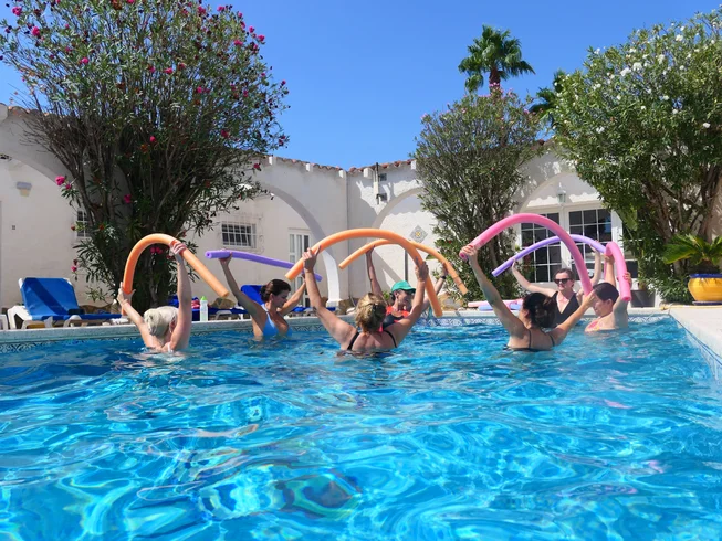 Participants enjoying a pool activity at La Crisalida
