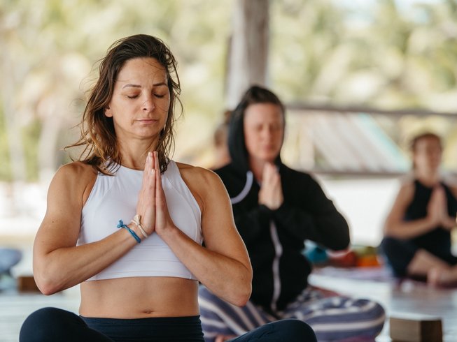Women practicing Yoga in a splendid spot for yoga retreats in Iceland