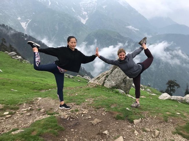 Women practicing Yoga in one of the top-rated yoga retreats in India