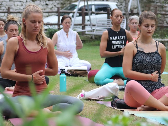 Women practicing yoga in an amazing spot for yoga retreats in India