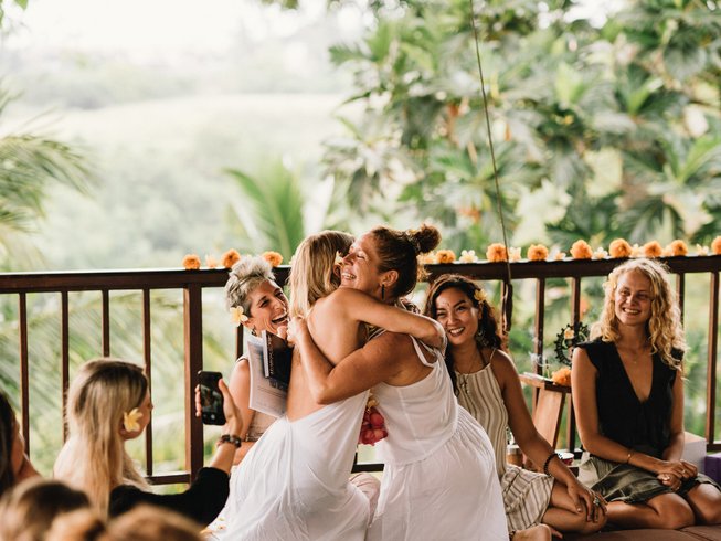 Bali luxury hotel suite guest enjoying a private yoga session on the beach